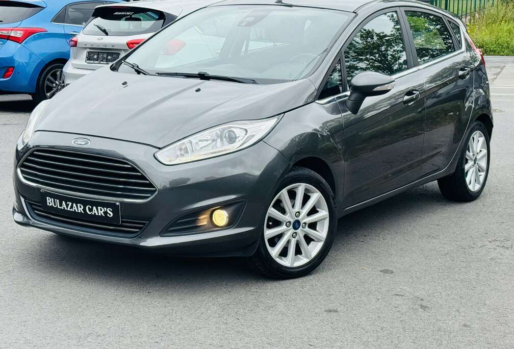 Ford Fiesta 1.0i Titanium*1 ER MAIN*CARNET*CLIM*GARANTIE 12 MOIS
