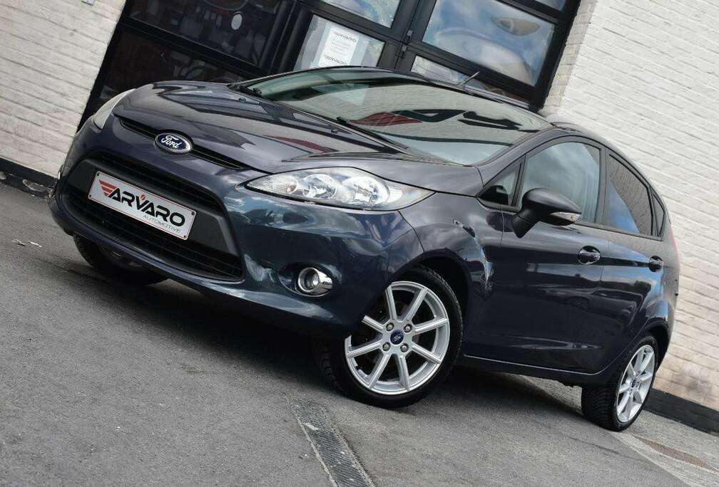 Ford 1.25i Champions Edition / PDC / Verw Zetels / Airco / Garantie