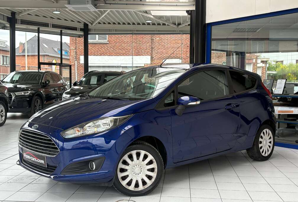 Ford Fiesta 1.0i *TITANIUM * CLIM * CARNET * 1ER PROP *