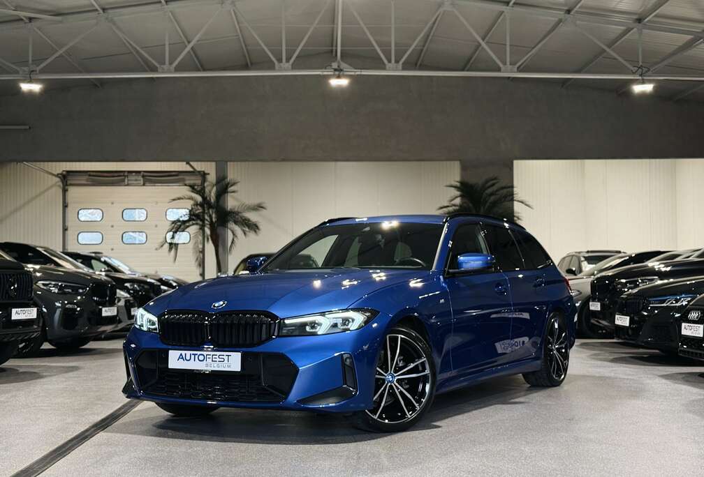 BMW iA Touring M-Sport Portimao Blauw - Garantie