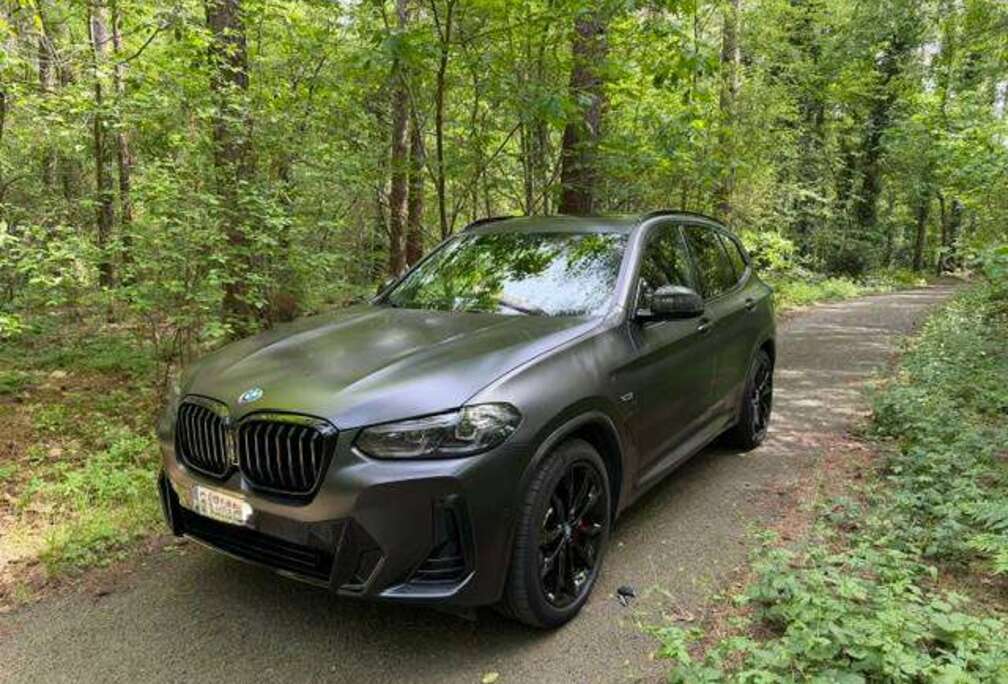 BMW X3 xDrive30e - mat zwart - 292 PK - trekhaak - cognac leder - pano dak - plus set winterbanden RFT en wintermatten