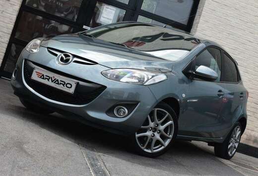 Mazda 1.3i Sport Navigator / PDC / Verw Zetels / Airc ...